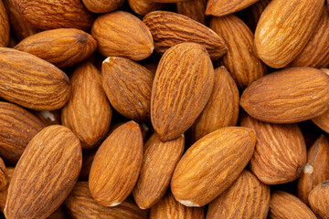 Almond nuts close up. Nut almond close up. Product rich in minerals and vitamins. Almond kernels. Texture of Almond kernels.	
