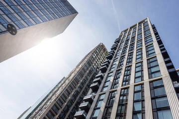 Fototapeta na wymiar Modern buildings in London viewed from below with sunlight.