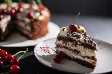 Cherry cake and chocolate on the background