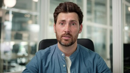 Speaker focused businessman talking at webcam making conference video call for job interview, business coach looking at camera recording webinar, online training, e-coaching, consulting client online.