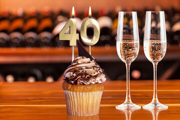 Fototapeta na wymiar Cupcake With Numbers And Glasses With Wine For Birthday Or Anniversary