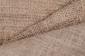 Linen in different textures and colors. Natural fabrics from organic flax and cotton, homespun textile handmade. Burlap and canvas for eco, rustic, boho, hygge decor closeup background