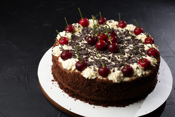 Cherry, red berry crumble in baking dish. Grey background.