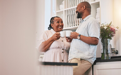 Coffee, happy and a talking black couple in the kitchen, laughing and relax in the morning. Smile, love and an elderly African man and woman speaking with a tea drink and conversation in a house