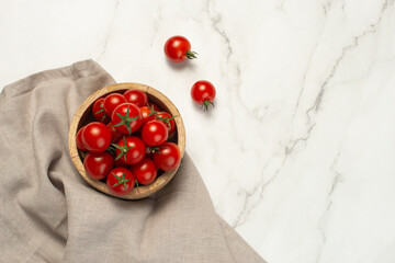 Culinary background. Tomatoes in a plate, spices and oil on a gray background