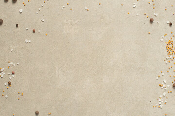 Gray cooking background with spices, oil and other kitchen tools