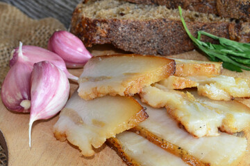 lard with garlic on a wooden board
