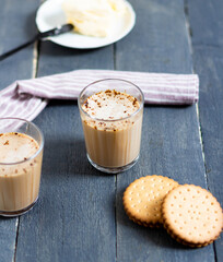 Cocoa in a glass with two cookies