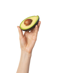 Avocado in female hands on a white isolated background