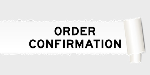 Ripped gray paper background that have word order confirmation under torn part