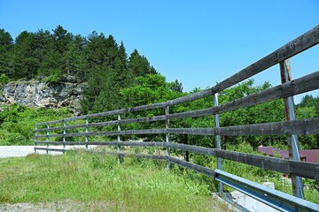 Fototapeta premium Wooden fence over the bridge over the river