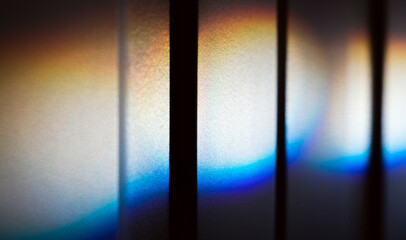 Spectrum colors of a ray of sunlight  over white wall