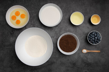 Cookies ingredients in white bowls