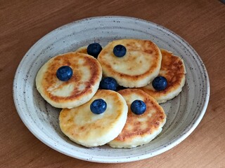 pancakes, cheesecakes with blueberries. Healthy breakfast.