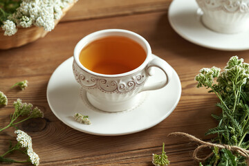 A cup of herbal tea with fresh yarrow - medicinal plant