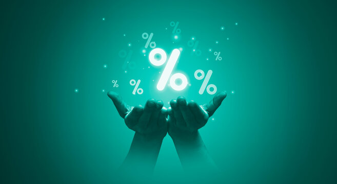 Two hand holding  percentage symbol for financial banking increase interest rate or mortgage investment dividend from business growth concept.