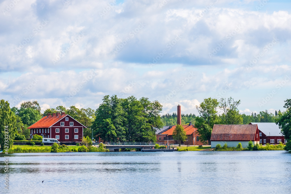 Canvas Prints Old historic industrial buildings by a lake in sweden