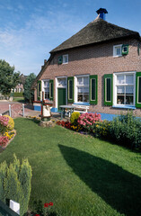 Staphorst traditional farmhouse and garden. Countryside. Overijssel. Netherlands 1990