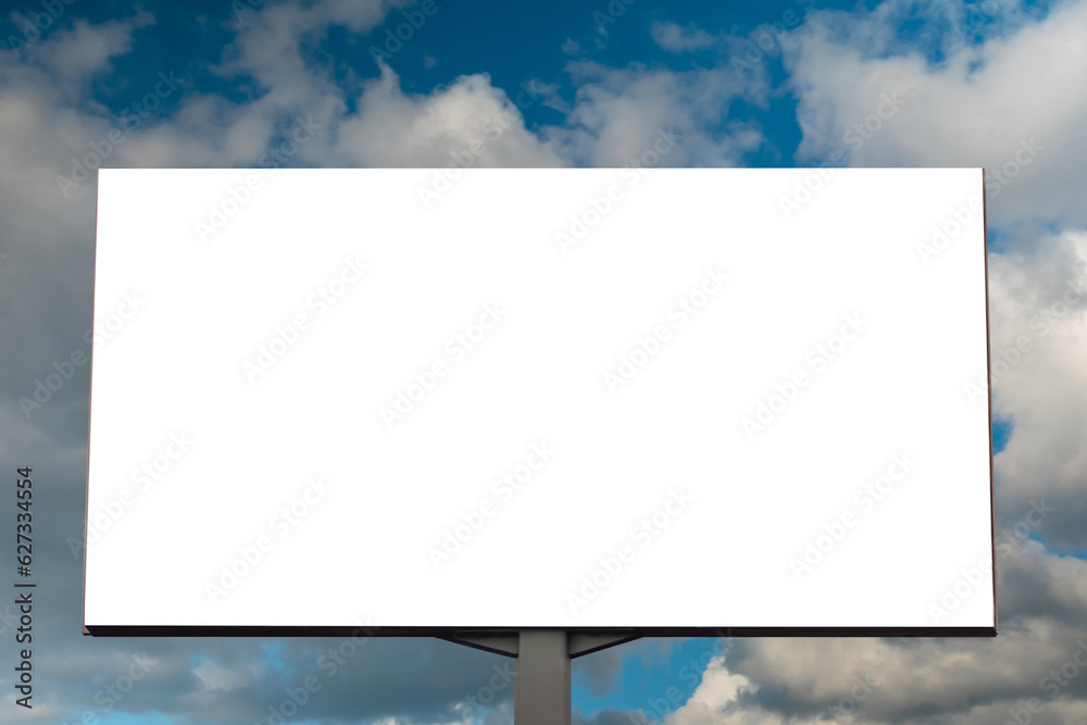Wall mural front view: blank white billboard or large display against blue sky with white clouds - mock up. con