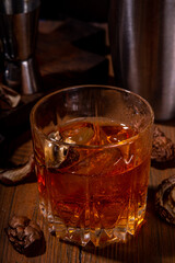 

Trendy hard alcohol mushroom cocktail, booze-free mushroom infused drinks in various cocktail glasses, with bar utensils on dark wooden background copy space