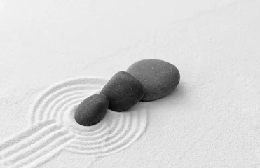 Foto op Canvas Zen Garden with Grey Stone on White Sand Line Texture Background, Black Rock Sea Stone on Sand Wave Parallel Lines Pattern in Japanese stye, Simplicity Day, Meditation,Zen like concept © Anchalee