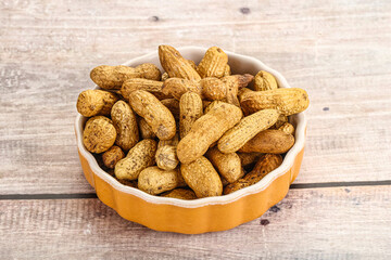 Raw ripe unpeeled peanut heap