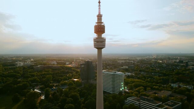 Aerial footage cityscape Florianturm or Florian Tower telecommunications tower and Westfalenpark in Dortmund, Germany