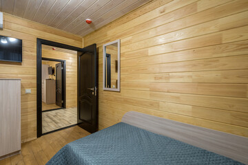 interior of wooden eco bedroom in studio apartments,  hostel or homestead