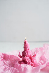 The candle with the goddess Lakshmi is pink. Femininity and fertility. Meditation and Buddhism - 627343104