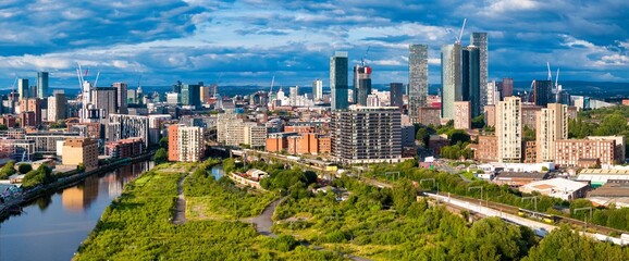 Manchester Skyline Panorama with a Cloudy Sky - obrazy, fototapety, plakaty