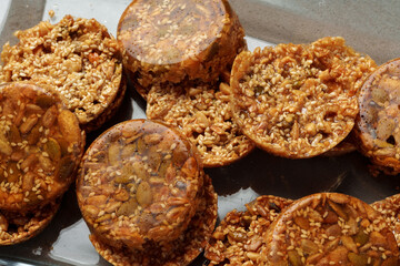 Crunchy homemade cookies on glass plate on gray background