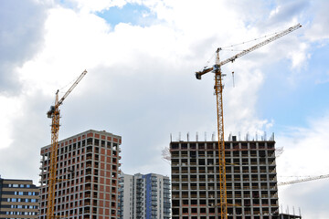 Fototapeta na wymiar construction site with apartment buildings and cranes isolated copy space 