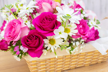 bouquet of pink roses in basket