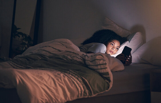 Tired, night and phone with woman in bedroom for social media app, insomnia and networking. Communication, contact and internet with female person in bed at home for mobile, online and technology