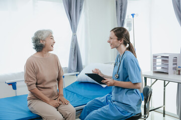 Portrait of beautiful doctor sharing data from digital tablet with elderly patient