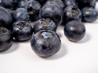 Ripe blueberries on a light background. blueberries close up