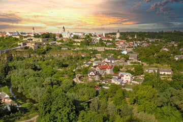 Fototapeta premium Kamianets-Podilskyi cityscape with dramatic sunset, Ukraine.