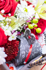 bouquet of red roses and gift