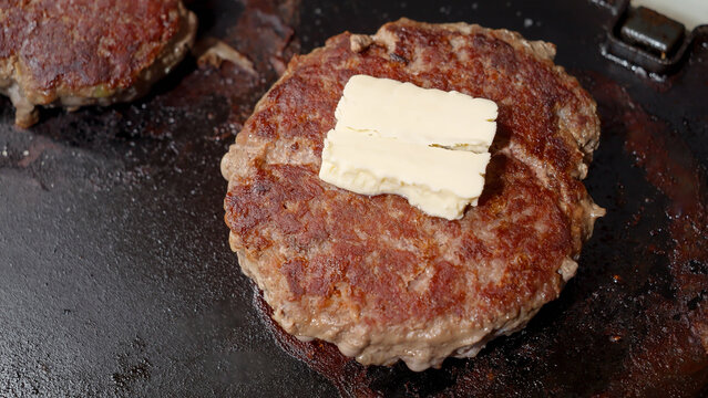 Top View On Butter Melting On Beef Burgers In Electric Grill. Cooking At Home, Kitchen Appliance, Healthy Nutrition, Hamburger Ingredients.