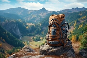 Young hiker with backpack in mountains