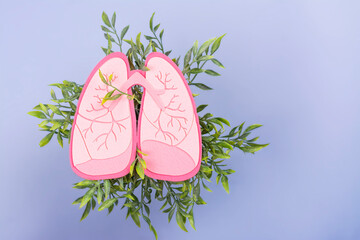 Healthy pink lungs over green foliage. World Tuberculosis Day, Pneumonia day or World Lung Day...