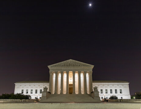 U.S. Supreme Cout Building at night under the crescent moon, Washington D.C