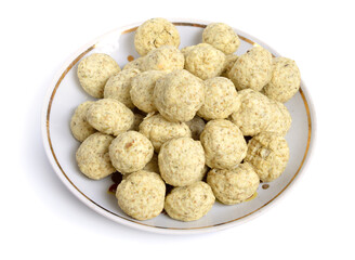 Kashk, qurut, gurt, chortan, or aaruul and khuruud. With herbs isolated on white background