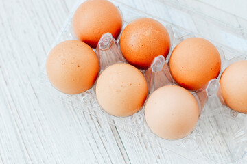 Store chicken eggs in a tray on kitchen boards