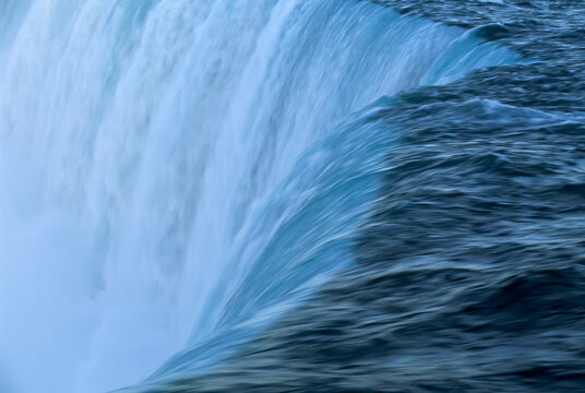 Water gushing over Brooks Falls, a favorite of salmon and bears, in  Katmai National Park and Preserve, Alaska, USA; Alaska, United States of America