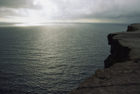 View from a St. Paul Island cliff of the sun-reflected Bering Sea; St. Paul Island, Pribilof Islands, Alaska, United States of America