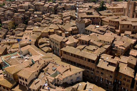 Buildings seem to run into each other in this aerial view of Siena; Siena, Tuscany, Italy