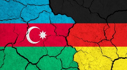Flags of Azerbaijan and Germany on cracked surface - politics, relationship concept