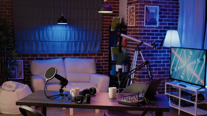 Nobody in podcast production studio with professional microphone and headphones for streaming...