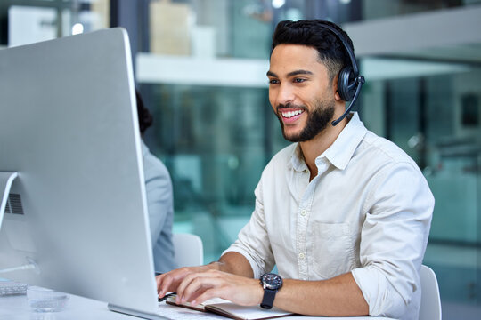 Business man, call center and web support communication at a computer in a office. Phone conversation, smile and male worker with contact us, crm and customer service job in a consulting agency